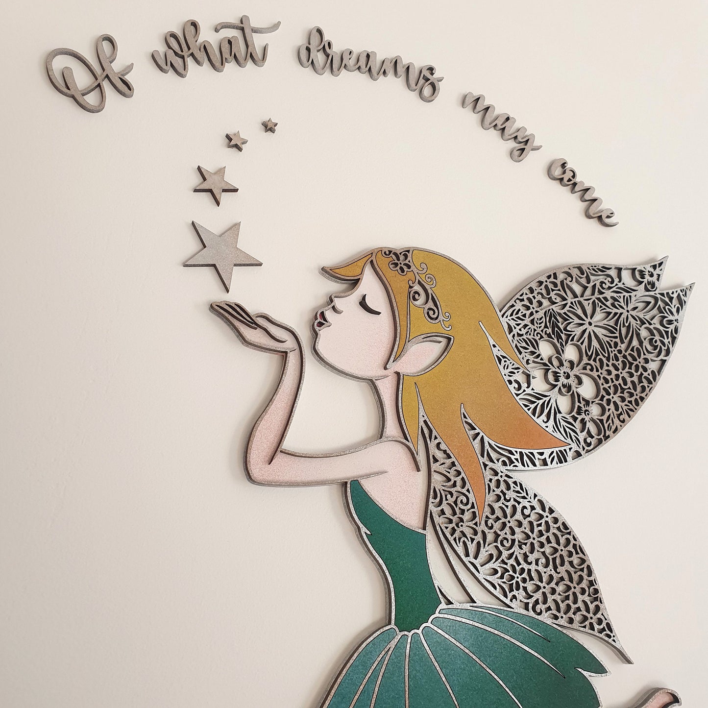 Wooden MDF laser cut fairy, 2 layers with detailed patterned wings, stars and the words 'Of what dreams may come'